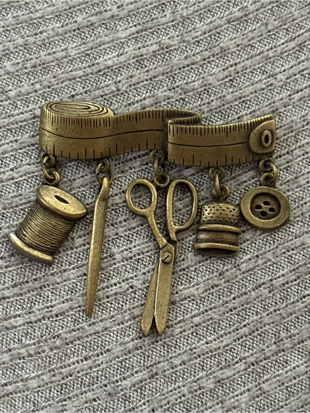 Vintage JJ signed brass tone quilting/sewing theme brooch w dangly charms